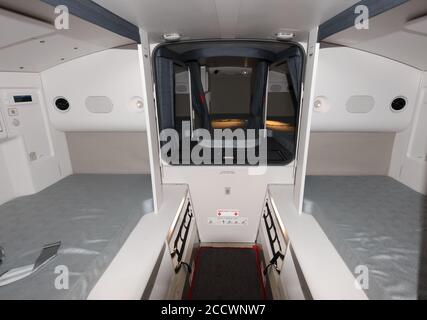 Ruhebereich der Kabinenbesatzung an Bord des modernen Airbus A350. Bunkerbereich mit Betten für Flugbegleiter auf Langstreckenflügen, die ihre Reise überschreiten. Stockfoto