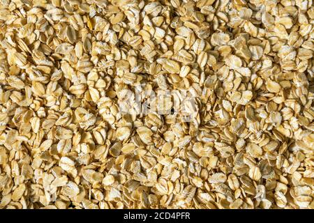 Haferflocken, Haferflocken Foto, Hafer Hintergrund. Textur, Ernährung Lebensmittel für Frühstück Stockfoto