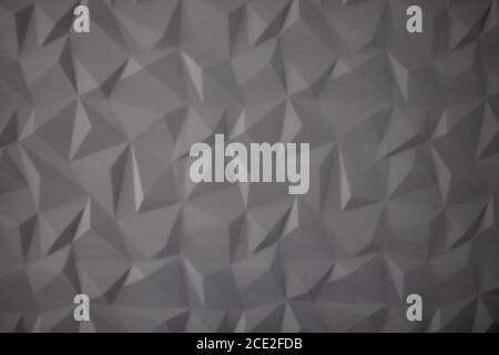 Abstrakter Hintergrund von Polygonen auf grauem Hintergrund. Stockfoto