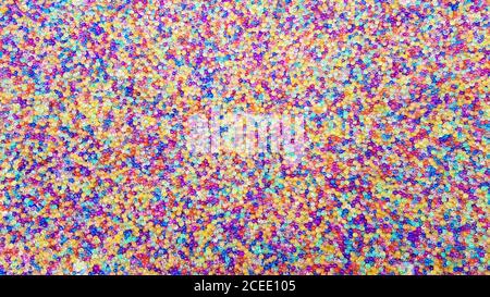 Viele verschiedene farbige Hydrogelkugeln. Set von mehrfarbigen orbis. Kristallwasserperlen für Spiele. Heliumballons. Kann als Hintergrund verwendet werden. Poly Stockfoto