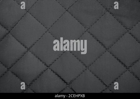 Tuch in Raute. Gesteppter synthetischer Stoff Textur Hintergrund. Stockfoto