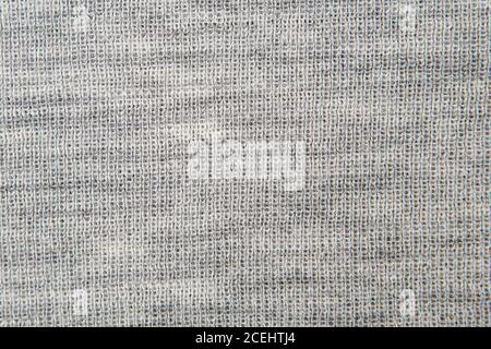 Nahaufnahme auf stricken Wollpelz Textur. Grau flauschig gewebten Faden Pullover als Hintergrund. Stockfoto