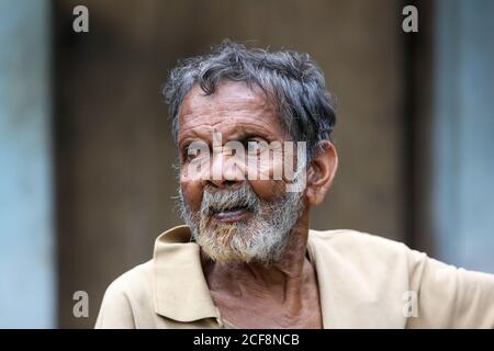 PANIYAN STAMM, Old man Portrait, Chulliyod Dorf, Vannathara Kolonie, Kerala, Indien Stockfoto