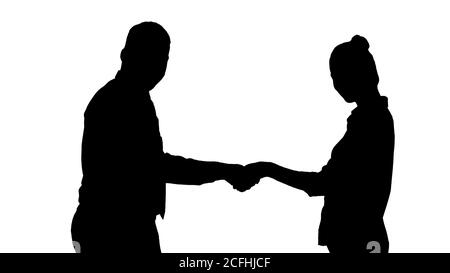 Silhouette Handshake von Geschäftsfrau und Geschäftsmann posiert für das Bild. Stockfoto