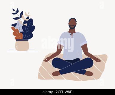 Afro-amerikanischer Mann sitzt mit gekreuzten Beinen auf dem Boden und meditiert. Junger Mann in Yoga-Haltung, Meditation, Achtsamkeit üben Stockfoto