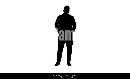 Silhouette männlichen Afrikanischen Arzt stehen mit Händen in den Taschen. Stockfoto