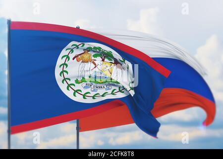 Winkende russische Flagge und Flagge von Belize. Nahaufnahme, 3D-Illustration. Stockfoto