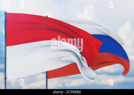 Winkende russische Flagge und Flagge Indonesiens. Nahaufnahme, 3D-Illustration. Stockfoto
