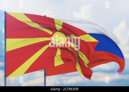 Winkende russische Flagge und Flagge von Nord-Mazedonien. Nahaufnahme, 3D-Illustration. Stockfoto