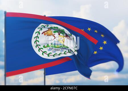 Flagge der Europäischen Union und Flagge von Belize schwenken. Nahaufnahme, 3D-Illustration. Stockfoto