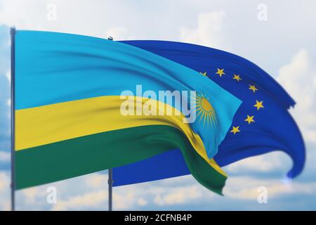 Flagge der Europäischen Union und Flagge von Ruanda schwenken. Nahaufnahme, 3D-Illustration. Stockfoto