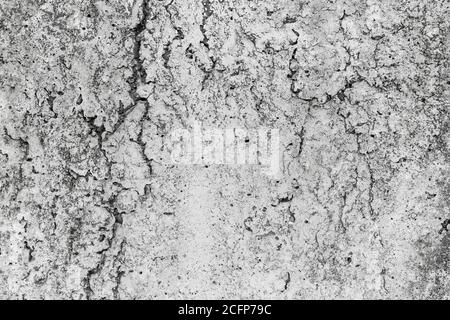 Gebrochener Betonhintergrund mit Rissen und Falten Nahaufnahme Stockfoto