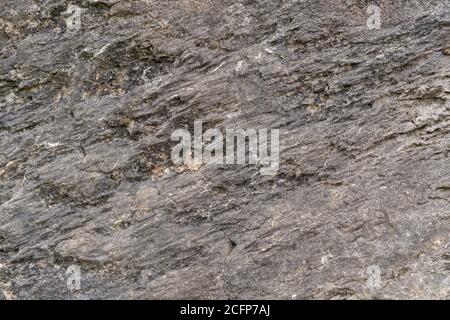 Grungy geknackt Stein Textur aus natürlichen Rock Retro-Stil. Verwitterte alte Wand Hintergrund. Konzept des alterierten Baumaterials Stockfoto