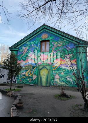 Street Art auf der Hauswand neben dem Eingang zu Christiania freetown. Kopenhagen/Dänemark Stockfoto