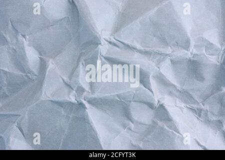 Hellblauer, zerknitterter Papiertextur-Hintergrund. Nahaufnahme. Stockfoto