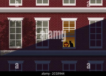 In der Dämmerung leuchtet eine Halloween Jack-o-Laterne im Fenster eines gemauerten Wohnhauses. Eine schwarze Katze sitzt neben dem Kürbis. Stockfoto