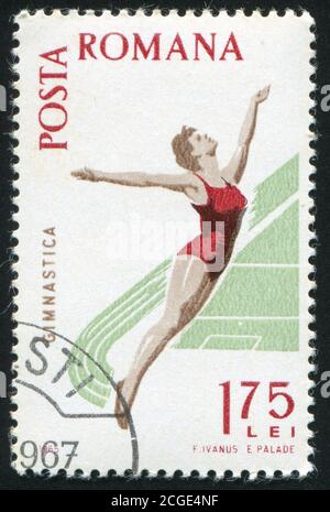 RUMÄNIEN - UM 1965: Briefmarke gedruckt von Rumänien, Schauturnen, um 1965. Stockfoto