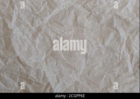 Papier mit Falten Textur Hintergrund. Pergamentpapier.Horizontale Ausrichtung. Stockfoto