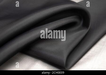 Verdrehter Wirbel aus Organza Stoff grau Textur Stockfoto