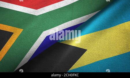 Südafrika und Bahamas zwei Flaggen Textiltuch, Stoff Textur Stockfoto