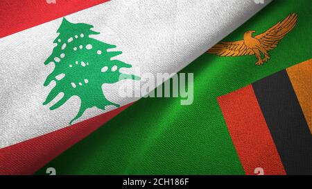 Libanon und Sambia zwei Flaggen Textiltuch, Stoff Textur Stockfoto