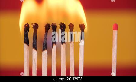 Coronavirus-Ausbruch, soziales Distanzierungskonzept. Brennende Spiele auf Spanien Flagge Hintergrund. Konzept: Verbreitung Virus Mechanismus. COVID-19 Stockfoto