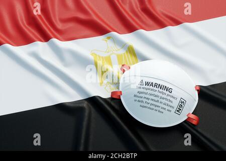 Coronavirus medizinische chirurgische Gesichtsmaske auf der ägyptischen Nationalflagge. Krankheit, Pandemie, Virus covid-19 in Ägypten, Konzept 3d Rendering Illustration Stockfoto