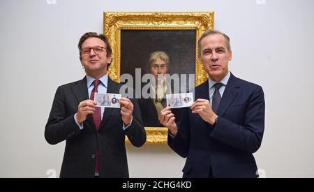 Alex Farquharson (links), Direktor der Tate Britain, und Mark Carney, Gouverneur der Bank of England, mit der neuen Note £20, die den Künstler JMW Turner in der Tate Britain in London zeigt. Stockfoto