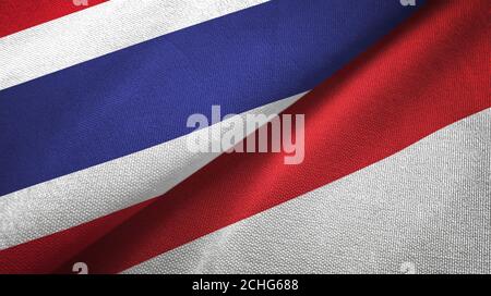 Thailand und Indonesien zwei Flaggen Textiltuch, Stoff Textur Stockfoto