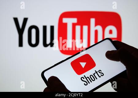 Stafford / UK - September 14 2020: Youtube Shorts app logo seen on the silhouette of smartphone in a hand. It is a new short looping video platform. R Stock Photo