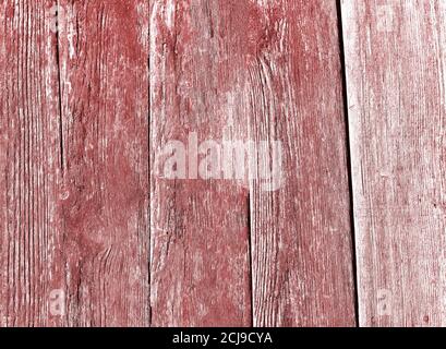 Nahaufnahme einer alten verwitterten rot lackierten Holzstruktur Stockfoto
