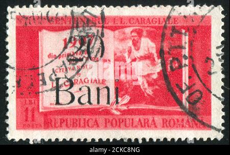 RUMÄNIEN - UM 1952: Briefmarke gedruckt von Rumänien, zeigt Buch und Malerei, um 1952 Stockfoto