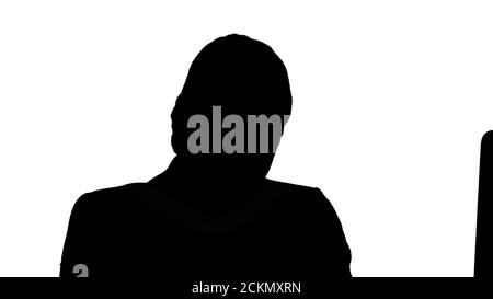 Silhouette lächelnde junge Frau Blick auf die Kamera. Stockfoto