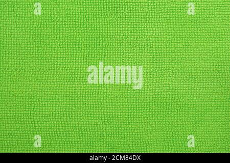 Oberfläche aus grünem Mikrofasertuch, Makro-Textil-Muster Hintergrund. Stockfoto