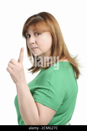 Lustige Frau drohte mit dem Zeigefinger an den Betrachter. Stockfoto