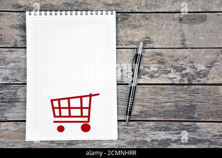 Abbildung des Einkaufswagens auf der Notizbuchseite Stockfoto