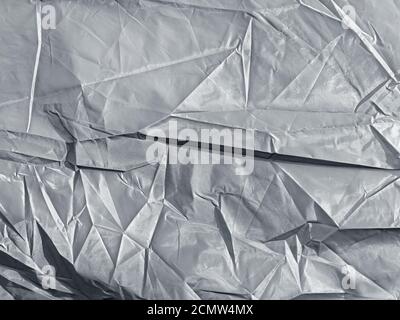 Hintergrund der zerknitterten Silber Synthetik-Gewebe Stockfoto