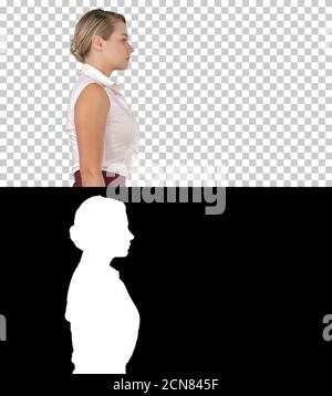 Junge Geschäftsfrau beim Gehen, Alpha Channel Stockfoto