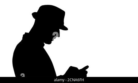 Silhouette ernsthafte arabisch casual Mann mit Smartphone beim Gehen. Stockfoto