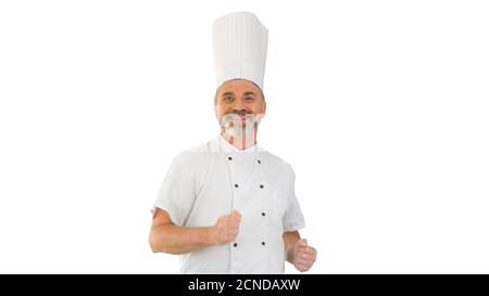 Reifer Koch mit Bart und in weißer Uniform tanzt weiter Weiß, Bac Stockfoto