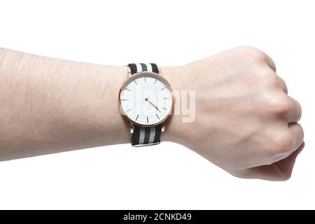 Mann schaut seine Uhr isoliert auf weißem Hintergrund. Stockfoto