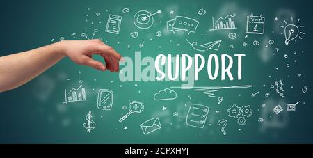 Nahaufnahme der zugeschnittenen Hand, die auf DIE AUFSCHRIFT DES SUPPORTS zeigt, modernes Business Solution-Konzept Stockfoto