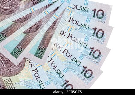 10 Polish Zloty Bills liegt isoliert auf weißem Hintergrund mit Kopieplatz gestapelt in Fächerform Nahaufnahme. Konzept für Finanztransaktionen Stockfoto