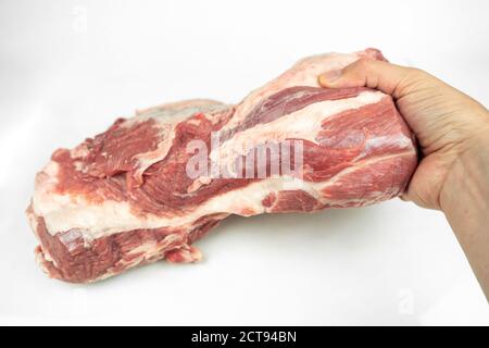 Großes Stück Fett Schweinefilet, rohes Fleisch, isoliert auf weiß Stockfoto