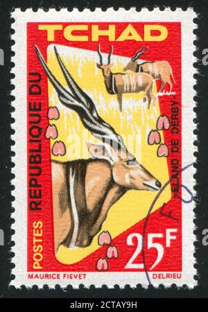 TSCHAD - UM 1965: Briefmarke gedruckt von Tschad, zeigt Derby Eland, um 1965 Stockfoto