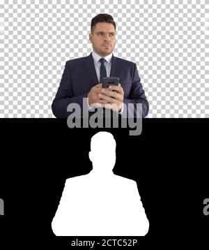 Auf der Suche nach einer Antwort gut aussehende Geschäftsmann mit seinem smart Stockfoto