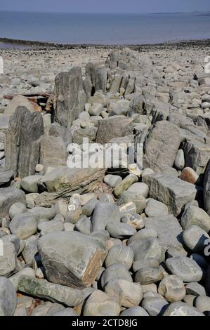 Die Überreste der Lilstock Harbour Wellenbrecher in der Nähe von Kilve in Somerset Stockfoto