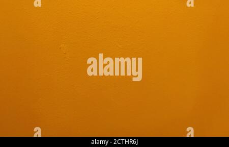Orange bemalter Wandhintergrund oder Textur Stockfoto