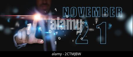 november. Tag 20 des Monats, Ankündigung des Datums der Geschäftstreffen oder Veranstaltung. Geschäftsmann hält den Namen des Monats und des Tages auf seiner Hand. Herbst Stockfoto