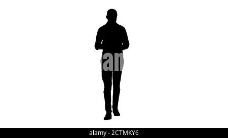 Silhouette Araber Mann zu Fuß und mit Tablet Surfen im Internet. Stockfoto